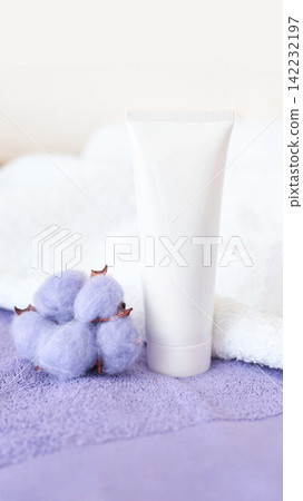 Blank Skincare Tube Positioned Beside Lavender Cotton Bolls On Textured Towel In Bright Minimalist 142232197