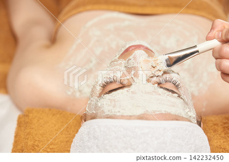 Asian Female Receiving Relaxing Facial Mask Spa Treatment For Rejuvenation And Skincare Enhancement Asian Female Receiving Relaxing Facial Mask Spa Treatment For Rejuvenation And Skincare Enhancement 142232450