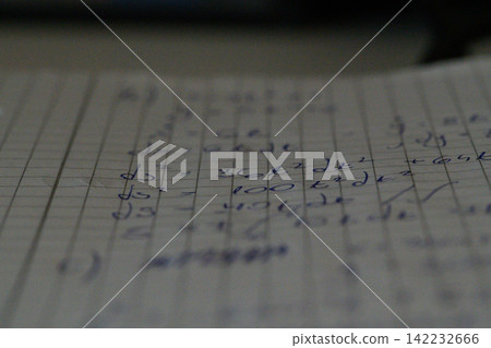 Blurred macro handwritten math equations notebook page Blurred macro handwritten math equations notebook page 142232666