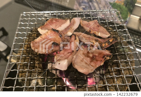 Juicy pork tongue grilled to perfection over a charcoal grill. Juicy pork tongue grilled to perfection over a charcoal grill. 142232679