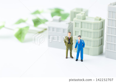 Businessman and office building Businessman and office building 142232707