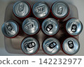 Ten soda cans sit in a tray, ready for use 142232977