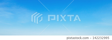 Clear blue sky with soft wisps of clouds Clear blue sky with soft wisps of clouds 142232995