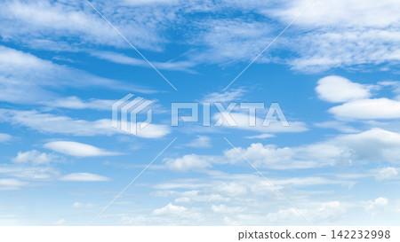 Clear blue sky with soft, wispy clouds Clear blue sky with soft, wispy clouds 142232998