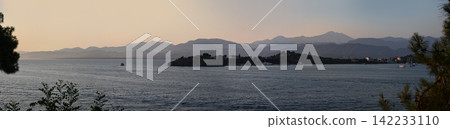 Panoramic landscape with a sea bay under a soft evening sky. Fethiye, Turkey Panoramic landscape with a sea bay under a soft evening sky. Fethiye, Turkey 142233110