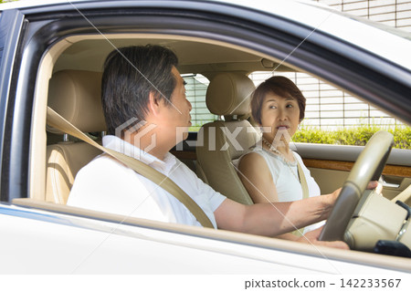 A senior couple going out in their car A senior couple going out in their car 142233567