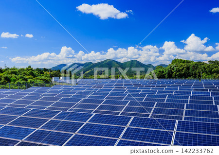 A vast solar power plant (mega solar) with a clear blue sky and midsummer clouds. A vast solar power plant (mega solar) with a clear blue sky and midsummer clouds. 142233762