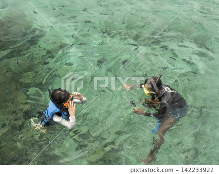 Two people snorkeling Two people snorkeling 142233922