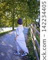 mature pregnancy with female traveler enjoying peaceful nature in green countryside 142234405