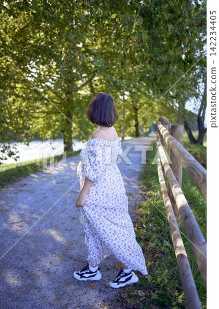 mature pregnancy with female traveler enjoying peaceful nature in green countryside mature pregnancy with female traveler enjoying peaceful nature in green countryside 142234405