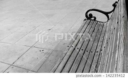 Black and white perspective shot of wooden park bench stock photo, classic monochrome outdoor park seating architecture Black and white perspective shot of wooden park bench stock photo, classic monochrome outdoor park seating architecture 142235412