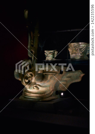 Bronze human face mask on display at Sanxingdui Museum, Guanghan, Sichuan, China Bronze human face mask on display at Sanxingdui Museum, Guanghan, Sichuan, China 142235596