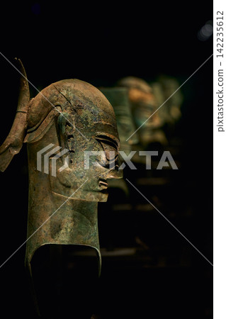 Bronze human face mask on display at Sanxingdui Museum, Guanghan, Sichuan, China Bronze human face mask on display at Sanxingdui Museum, Guanghan, Sichuan, China 142235612