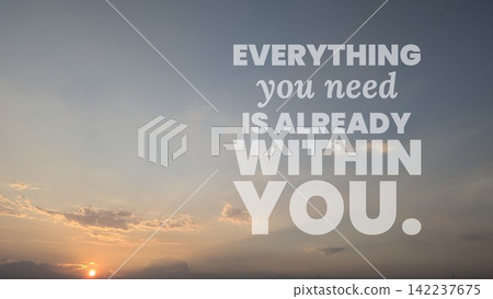 A wide angle view shows soft orange sunrise clouds glowing near the horizon under a clear sky. Overlaid motivational wisdom typography text states "EVERYTHING you need IS ALREADY WITHIN YOU." This A wide angle view shows soft orange sunrise clouds glowing near the horizon under a clear sky. Overlaid motivational wisdom typography text states "EVERYTHING you need IS ALREADY WITHIN YOU." This 142237675