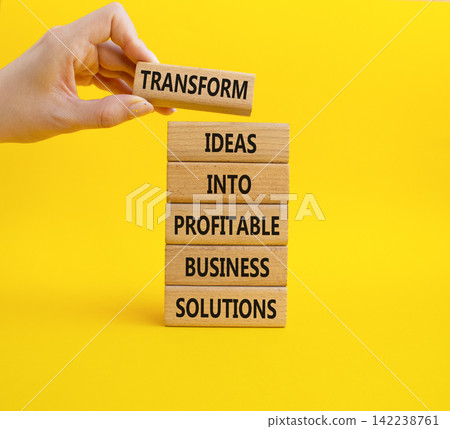 Transform ideas into profitable business solutions symbol. Concept words transform ideas into profitable business solutions on wooden blocks. Businessman hand. Beautiful yellow background. Business Transform ideas into profitable business solutions symbol. Concept words transform ideas into profitable business solutions on wooden blocks. Businessman hand. Beautiful yellow background. Business 142238761