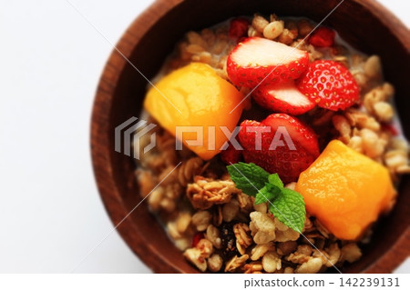 Strawberries, mangoes, and fruit granola Strawberries, mangoes, and fruit granola 142239131