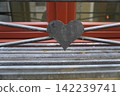 [Germany] Heart-shaped decoration on a window railing (Munich) 142239741