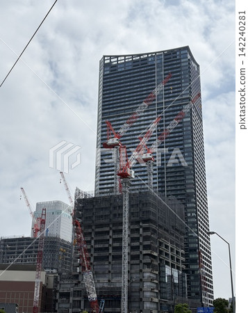 A view of a high-rise building under construction. A view of a high-rise building under construction. 142240281