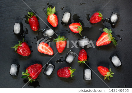 Fresh organic strawberry on black slate background. Flat lay. Fresh organic strawberry on black slate background. Flat lay. 142240405