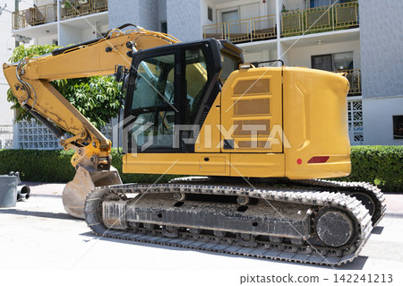 Excavator digger. Heavy equipment machinery. Industrial heavy equipment. Repair with heavy machinery excavator. Construction site and industrial heavy machine excavator. Shovel tractor Excavator digger. Heavy equipment machinery. Industrial heavy equipment. Repair with heavy machinery excavator. Construction site and industrial heavy machine excavator. Shovel tractor 142241213