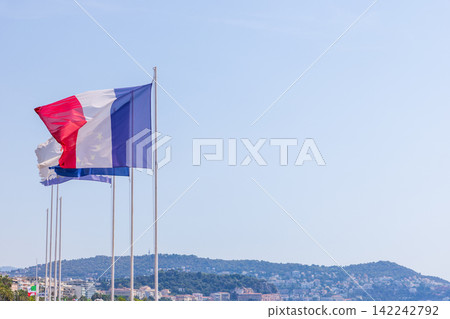 The summer sky over Nice in southern France and the French flag. The summer sky over Nice in southern France and the French flag. 142242792