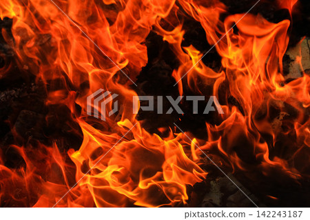 Vibrant Red and Orange Fire Flames Blaze Isolated on Black Background Vibrant Red and Orange Fire Flames Blaze Isolated on Black Background 142243187