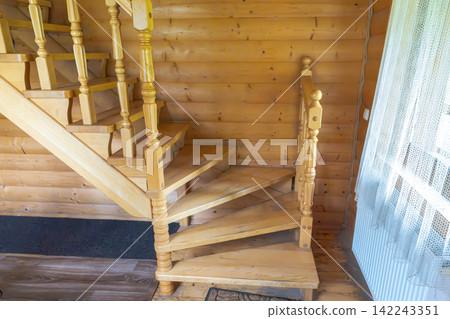 wooden staircase in a wooden house wooden staircase in a wooden house 142243351