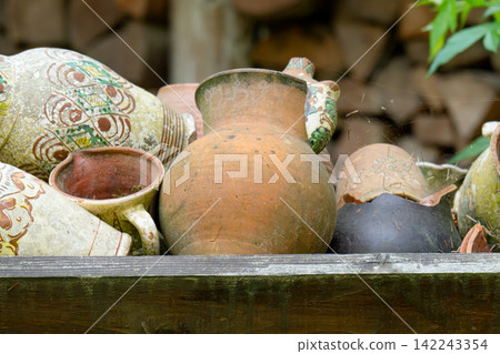 Vintage background of old jugs Vintage background of old jugs 142243354
