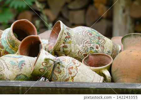 Vintage background of old jugs Vintage background of old jugs 142243355