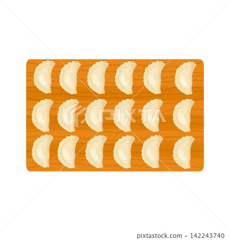 Dumplings on a wooden cutting board Dumplings on a wooden cutting board 142243740