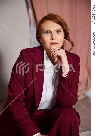 Determined ginger businesswoman in stylish attire with commanding presence Determined ginger businesswoman in stylish attire with commanding presence 142244568