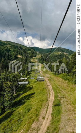 Rosa Khutor Chairlift Over the Mountain Slopes, Sochi Rosa Khutor Chairlift Over the Mountain Slopes, Sochi 142244978