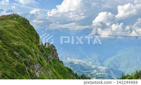 Suspension Bridge Above the Mountain Valley at Rosa Khutor Suspension Bridge Above the Mountain Valley at Rosa Khutor 142244988