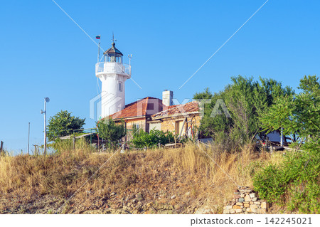 St Anastasia Island Lighthouse on Black Sea Coast. Small inhabited island, area is 1 ha in Bulgaria, Burgas Bay. Lighthouse, church, monastery, museum, hotel, restaurant. Cultural, historical monument St Anastasia Island Lighthouse on Black Sea Coast. Small inhabited island, area is 1 ha in Bulgaria, Burgas Bay. Lighthouse, church, monastery, museum, hotel, restaurant. Cultural, historical monument 142245021
