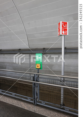 emergency equipment sign and Emergency contact equipment in modern train station. 142245515