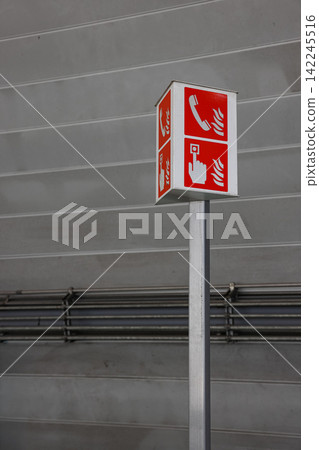 emergency equipment sign and Emergency contact equipment in modern train station. 142245516