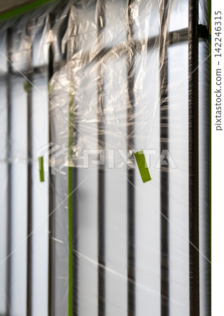 Window frame protection work during painting work for home renovations. Window frame protection work during painting work for home renovations. 142246315