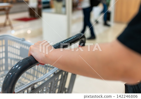 A lifestyle image capturing the hands of someone shopping. A lifestyle image capturing the hands of someone shopping. 142246806