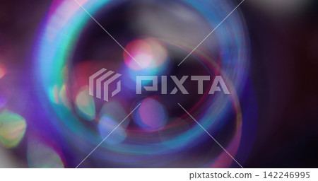 Bokeh light. Colorful glitter texture. Vibrant pink blue green lens flare bright optical glisten reflection on abstract illuminated background. Bokeh light. Colorful glitter texture. Vibrant pink blue green lens flare bright optical glisten reflection on abstract illuminated background. 142246995