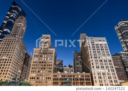 Night in Chicago city downtown. Skyscraper architecture. Chicago city cityscape. Cityscape night with skyscraper building. Skyline architecture. Chicago city with illuminated building. Urban lights Night in Chicago city downtown. Skyscraper architecture. Chicago city cityscape. Cityscape night with skyscraper building. Skyline architecture. Chicago city with illuminated building. Urban lights 142247122