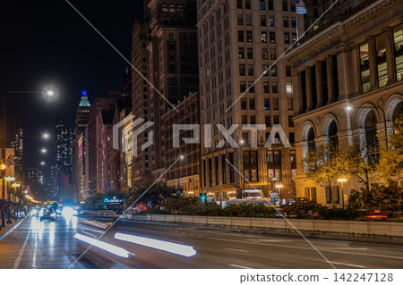Chicago, Il-October 22. 2024: Night city of Chicago. Business city. Night cityscape of Chicago skyscraper building. Chicago architecture of skyscraper. City night illuminated building. Skyscraper Chicago, Il-October 22. 2024: Night city of Chicago. Business city. Night cityscape of Chicago skyscraper building. Chicago architecture of skyscraper. City night illuminated building. Skyscraper 142247128