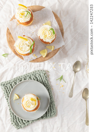 Lemon cupcakes with white frosting from top view Lemon cupcakes with white frosting from top view 142247283