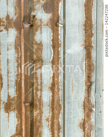 Rusty corrugated metal sheet background texture 142247286