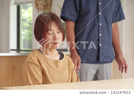 A husband who supports his senior wife who is suffering from physical and mental health problems. A husband who supports his senior wife who is suffering from physical and mental health problems. 142247631