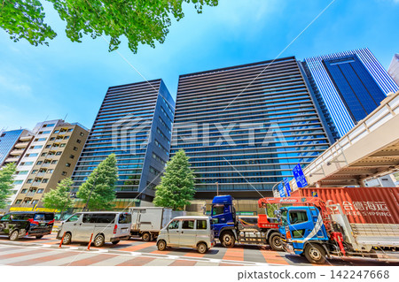 Urban landscape along Showa-dori Avenue in Chuo Ward, Tokyo, near Kyobashi 2-chome. 142247668