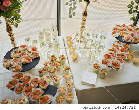 Tasting area decorated with assorted treats and elegant glassware Tasting area decorated with assorted treats and elegant glassware 142247721