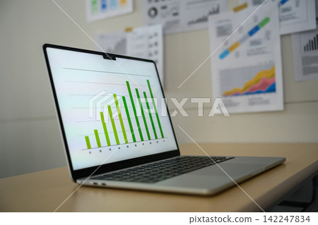 Bar graph and analysis data displayed on the laptop screen Bar graph and analysis data displayed on the laptop screen 142247834