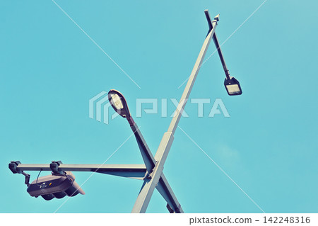 Street lights and blue sky Street lights and blue sky 142248316