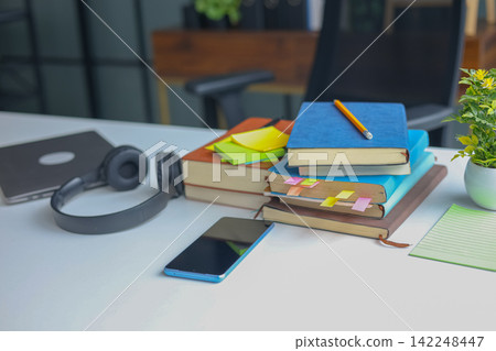 Exam Preparation Desk Layout with Study Tools and Sticky Notes, No People. Exam Preparation Desk Layout with Study Tools and Sticky Notes, No People. 142248447