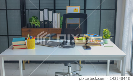 Table of Academic Research and E-Learning Concept with Stacked Books. 142248448